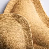 Selvklebende pelotter for avlastning av innsunkne forfotbuer